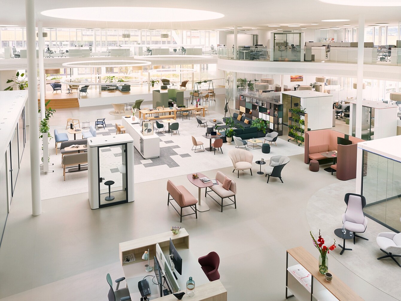 Spacious modern interior of a furniture store with various seating and tables in a bright setting