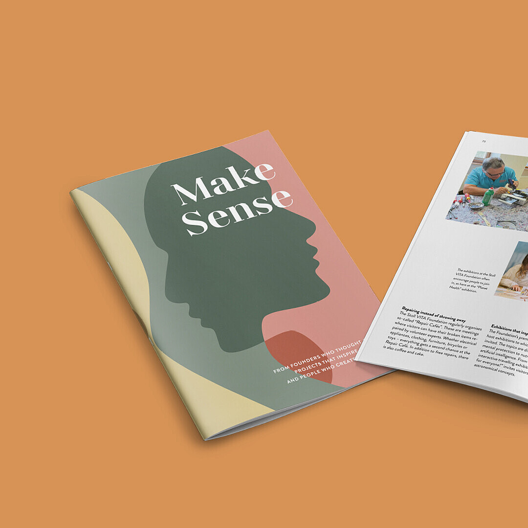 Magazine titled 'Make Sense' with a cover showing a green silhouette of a head on a pink and beige background, open to pages featuring photos of people working on crafts and a garden view with text.